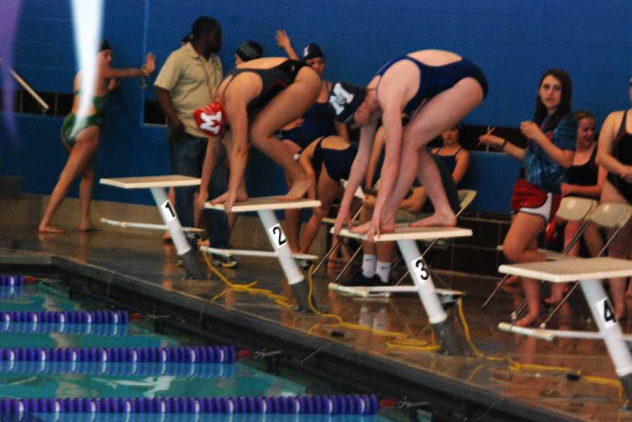 Swim improves, finishes second at home meet