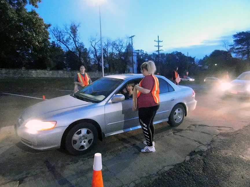 Junior Sydney Shields stops to get checked if she is wearing a seatbelt. October 26, students get checked if they are wearing their seatbelts when driving to school. This is a part of the Manhattan High School's Red Ribbon Saftey Week.