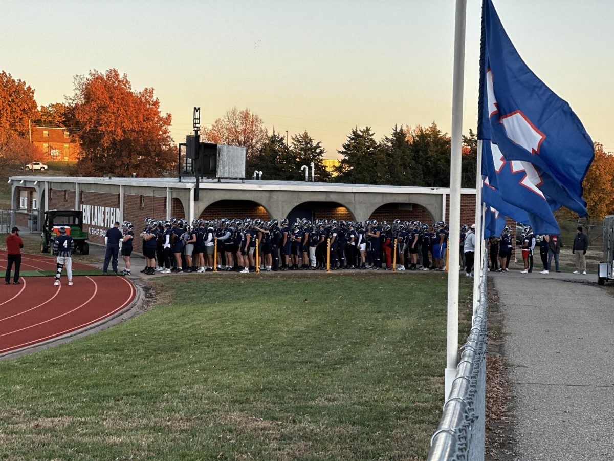 MHS football team members line up outside the locker room before taking the field together in what would be their last game of the season. Manhattan fell to Derby in the game Friday at Bishop.
photo courtesy of Kristy Nyp