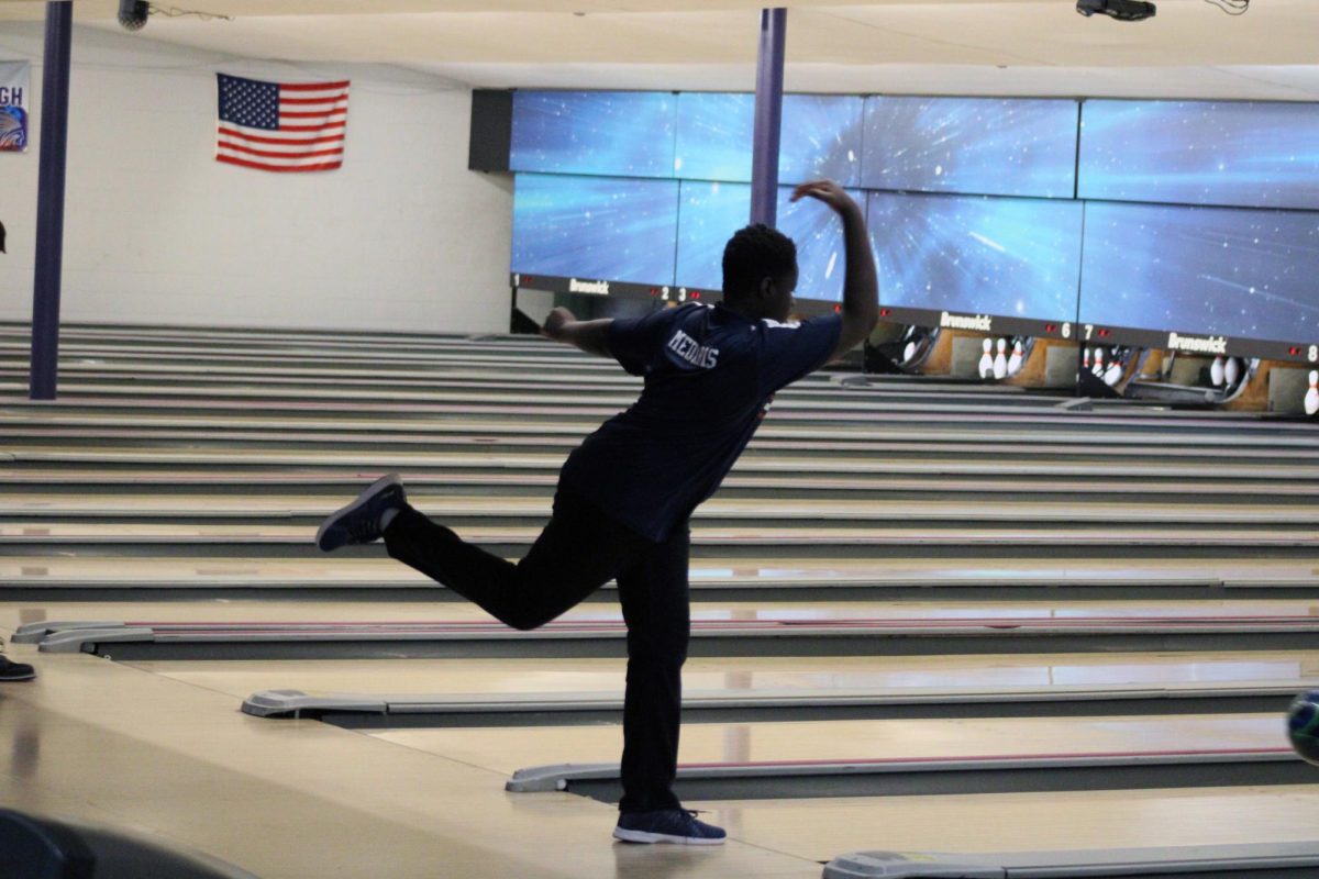 On a roll. Sophomore J.P. Medaris bowls in the home meet at Little Apple Lanes on Feb. 3.